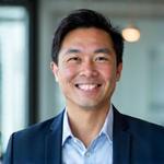 Professional photo of Liam Wong, a certified financial coach specializing in investment strategies.